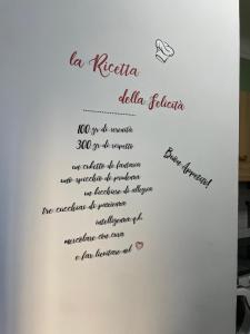 a letter on the side of a white refrigerator at CASA CRISTINA in Sanremo