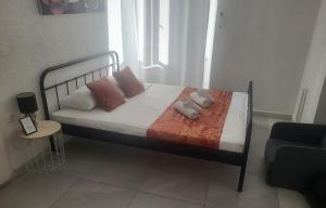 Ένα ή περισσότερα κρεβάτια σε δωμάτιο στο Cozy Rooms At Old City Gate