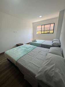 Postel nebo postele na pokoji v ubytování Apartamento en Sonsón + 6 fotografií