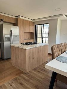 Kuchyň nebo kuchyňský kout v ubytování Apartamento en Sonsón