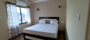 Mohit Paying Guest House客房内的一张或多张床位