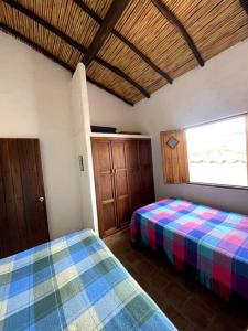 Postel nebo postele na pokoji v ubytování Casa Raiz