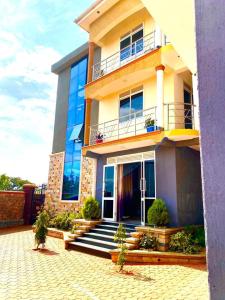 a building with a staircase in front of it at Jebel Hotel & Lounge Buloba in Kampala +13 photos