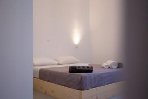Ένα ή περισσότερα κρεβάτια σε δωμάτιο στο Kastro Shared Pool Suites