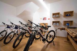 a group of bikes parked in a room at Residence Untermösslhof - La Villa in Lana