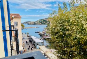 a view of a body of water from a building at Hôtel des Templiers in Collioure
