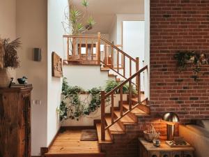 a brick staircase with plants on the wall at Quinta Amarela - B&B in Nazaré
