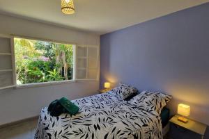 Postel nebo postele na pokoji v ubytování Maison avec jacuzzi