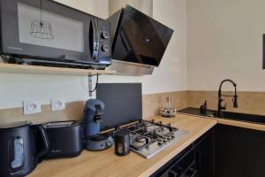 Kuchyň nebo kuchyňský kout v ubytování Maison avec jacuzzi