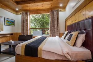 Ένα ή περισσότερα κρεβάτια σε δωμάτιο στο Hotel Cherry Manali