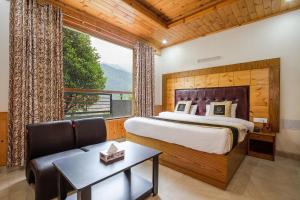 Ένα ή περισσότερα κρεβάτια σε δωμάτιο στο Hotel Cherry Manali