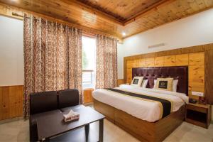 Ένα ή περισσότερα κρεβάτια σε δωμάτιο στο Hotel Cherry Manali