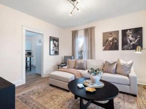a living room with a couch and a table at Newly Renovated - Professionally Designed - 2 BR in Lakewood