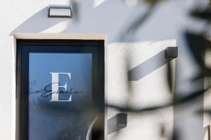 a sign on the side of a building at Essentia Rooms & Relax in Vasto