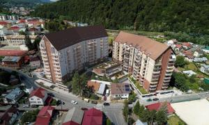 an overhead view of a city with buildings and a street at Royal Family Apartment in Sinaia
