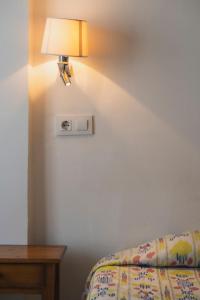 A bed or beds in a room at Hotel Amic Can Pastilla