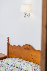 A bed or beds in a room at Hotel Amic Can Pastilla
