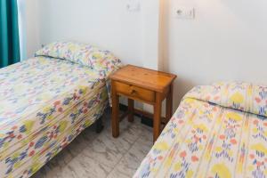 A bed or beds in a room at Hotel Amic Can Pastilla