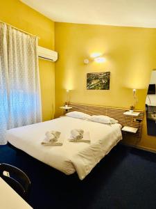 Postel nebo postele na pokoji v ubytování Smart Hotel Autodromo
