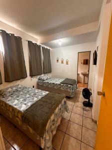 Ένα ή περισσότερα κρεβάτια σε δωμάτιο στο Apartamentos - Casinhas da Paulinha