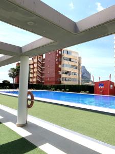 a view of a swimming pool in a building at Kenya 1ª Linea in Ifach