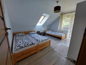 Letto o letti in una camera di Domek na Leśnej Wisła