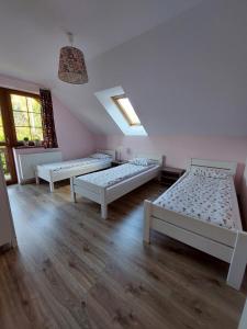 Letto o letti in una camera di Domek na Leśnej Wisła