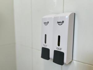 two wii controllers sitting on top of a counter at Seeds Hotel Klang Bayu Perdana in Klang