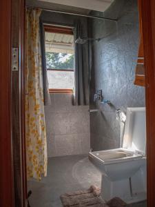 Vannituba majutusasutuses Hills Tale Backpackers Hostel