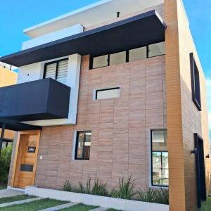 a large brick building with a balcony at Villa Pool action Vista Cana in Punta Cana