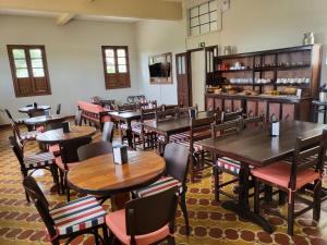 a restaurant with tables and chairs in a room at Boa Vista in Carmo da Mata