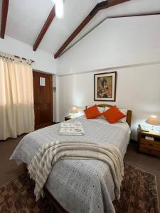 Postel nebo postele na pokoji v ubytování El Cumbe Inn