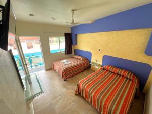 Katil atau katil-katil dalam bilik di Hotel Xestalito