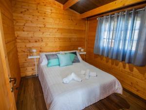 Postel nebo postele na pokoji v ubytování Cabaña 82 by Villamya + 12 fotografií