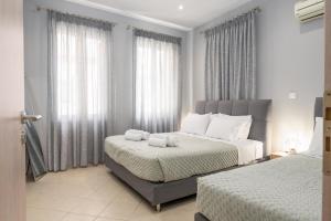 A bed or beds in a room at Casa Centrale ad Argostoli!