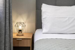A bed or beds in a room at Casa Centrale ad Argostoli!