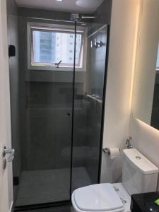 a bathroom with a shower and a toilet at Apartamento lindo com garagem in Sao Paulo
