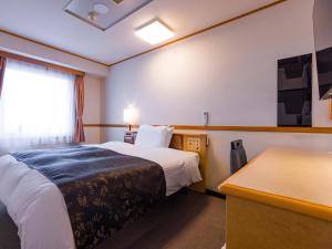 APA Hotel Miyagi Furukawa Ekimae客房内的一张或多张床位