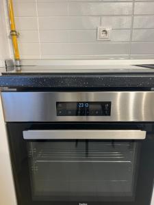 a stove top oven sitting in a kitchen at B&B Unicat in Bistriţa