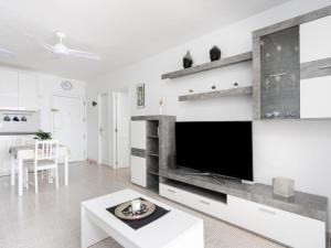 a living room with a large flat screen tv at Live Candelaria Tamonante in Candelaria +15 photos