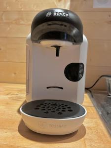 a mixer sitting on top of a wooden table at Gîte du Mont Mentes in Lachapelle-Graillouze +5 photos