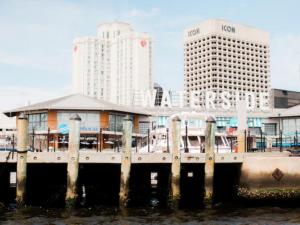 a dock in a city with tall buildings at Norfolk Waterside Marriott in Norfolk