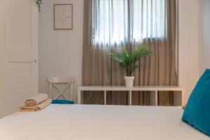 Postel nebo postele na pokoji v ubytování Urban Chic Loft Malaga City Center
