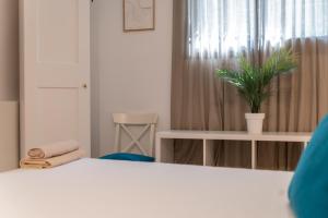 Postel nebo postele na pokoji v ubytování Urban Chic Loft Malaga City Center