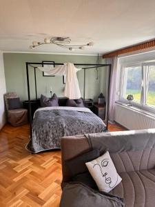 Postel nebo postele na pokoji v ubytování Pension FAULPELZ - Apartment mit Küche, Badewanne