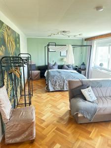 Postel nebo postele na pokoji v ubytování Pension FAULPELZ - Apartment mit Küche, Badewanne