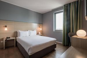 Ένα ή περισσότερα κρεβάτια σε δωμάτιο στο ClipHotel