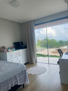 Giường trong phòng chung tại CASA VISTA MAR, CONd LUXO ESTILO RESORT +14 ảnh