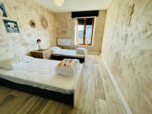 Postel nebo postele na pokoji v ubytování Maison 4-6 personnes proche Gerardmer
