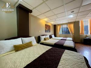 a hotel room with two beds in a room at Hotel Ensueños by HHG in Cuenca +81 photos